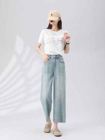 YEEYEEWang Wide-Leg Jeans in Light Blue, Asian-fit cut, full-body front standing pose with hand in pocket, beige cap, white graphic tee and chain shoulder bag.