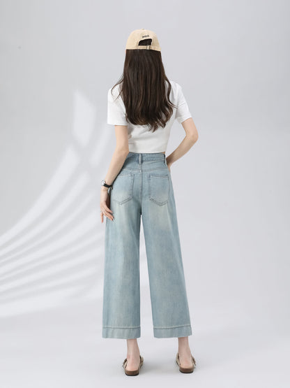 YEEYEEWang Wide-Leg Jeans in Light Blue, Asian-fit cut, full-body back view standing with hand resting on waistband, showing back patch pockets and beige cap.