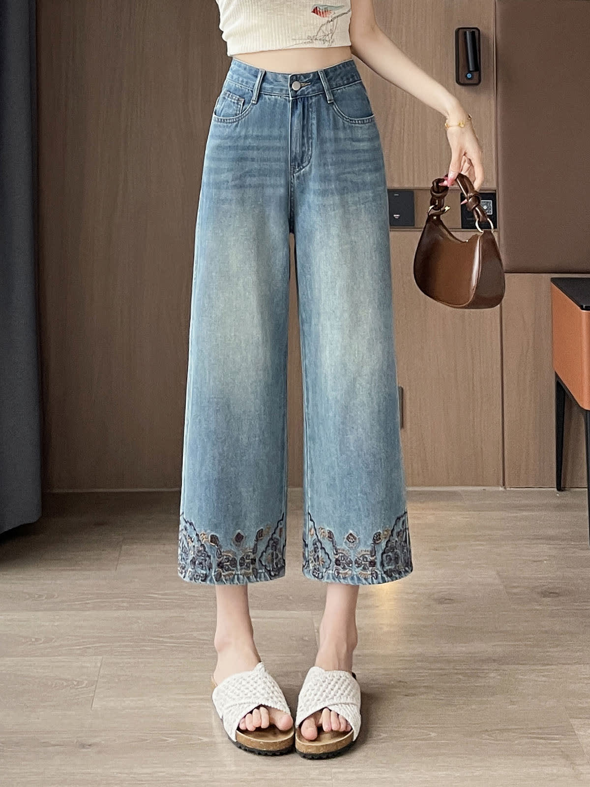 YEEYEEWang Straight Jeans in Vintage Blue, Asian-fit cut, waist-down front standing view holding a brown handbag, floral-embroidered hems, variant thumbnail.