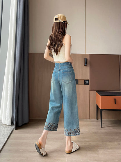YEEYEEWang Straight Jeans in Vintage Blue, Asian-fit cut, full-body back walking view showing back patch pockets, cap on head, floral-embroidered hems.