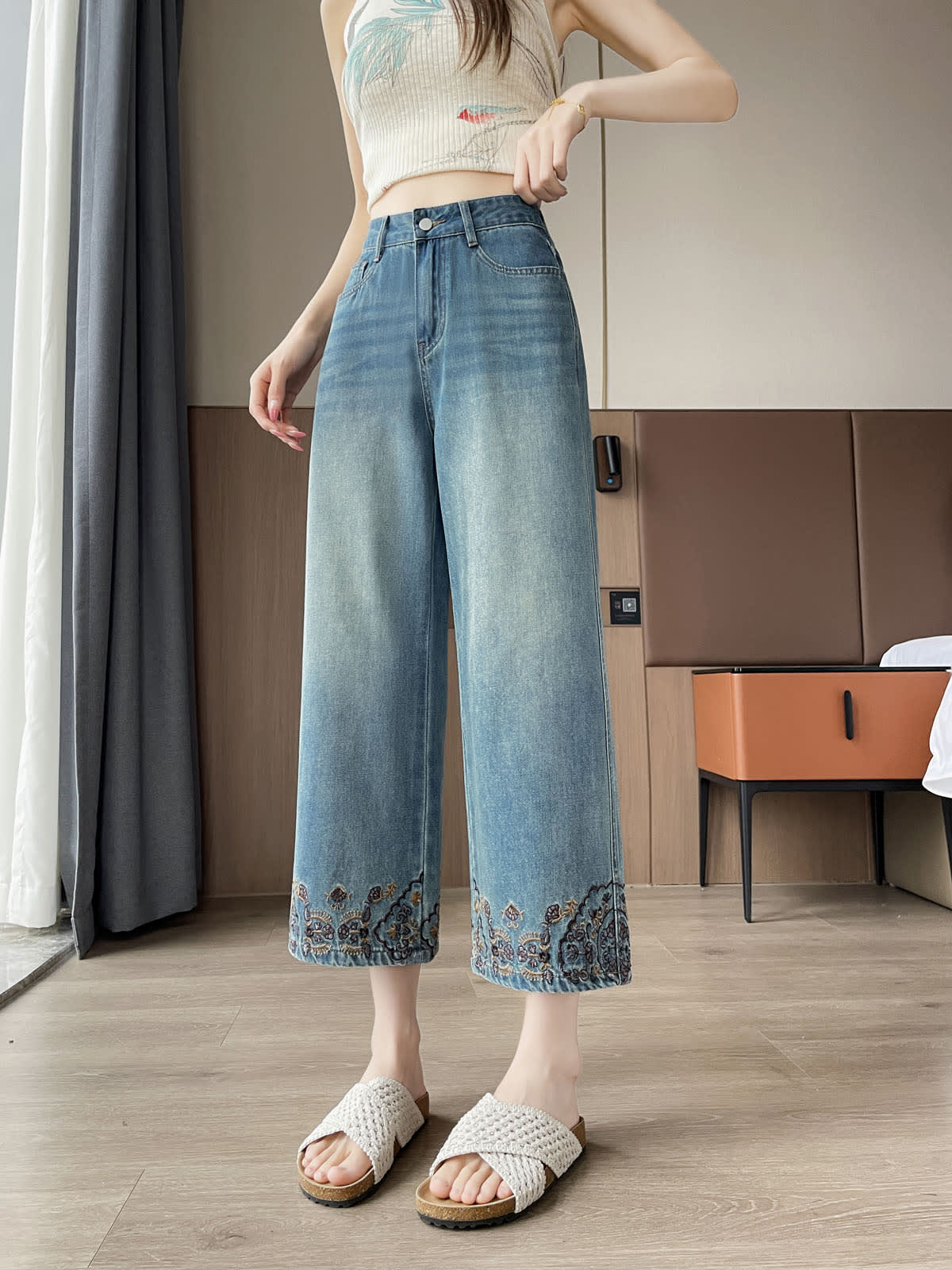YEEYEEWang Straight Jeans in Vintage Blue, Asian-fit cut, waist-down front view standing, embroidered floral hems and crochet slide sandals visible.