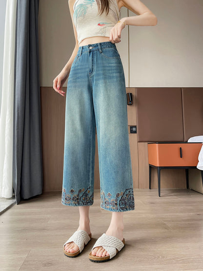 YEEYEEWang Straight Jeans in Vintage Blue, Asian-fit cut, waist-down front view standing, embroidered floral hems and crochet slide sandals visible.