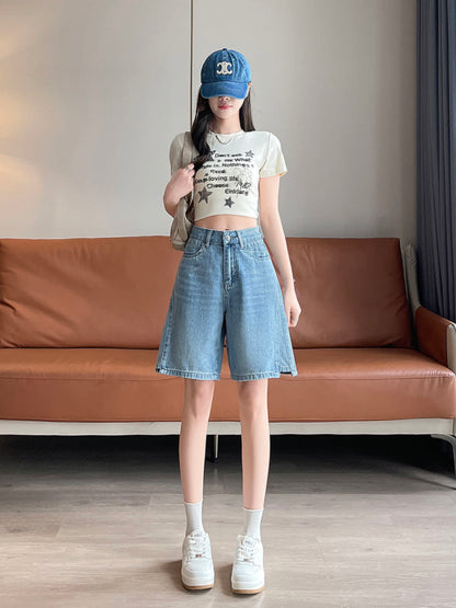 YEEYEEWang Denim Bermuda Shorts in Blue, Asian-fit cut, full-body front standing pose with a shoulder bag slung over one shoulder, styled with denim cap and white sneakers.