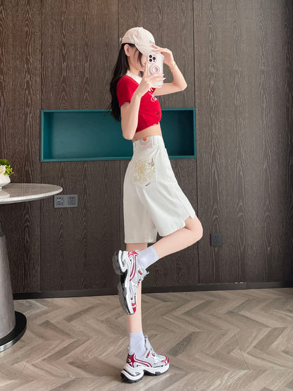 YEEYEEWang Denim Bermuda Shorts in White, Asian-fit cut, full-body side view with leg kicked back, phone held at face, embroidery visible on back pocket.