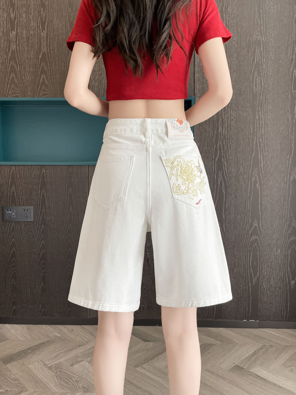YEEYEEWang Denim Bermuda Shorts in White, Asian-fit cut, waist-down back view with embroidered back patch pocket.