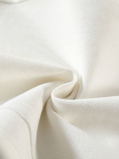 YEEYEEWang Denim Bermuda Shorts in White, Asian-fit cut, close-up of soft twill denim texture with a gentle rolled fold.