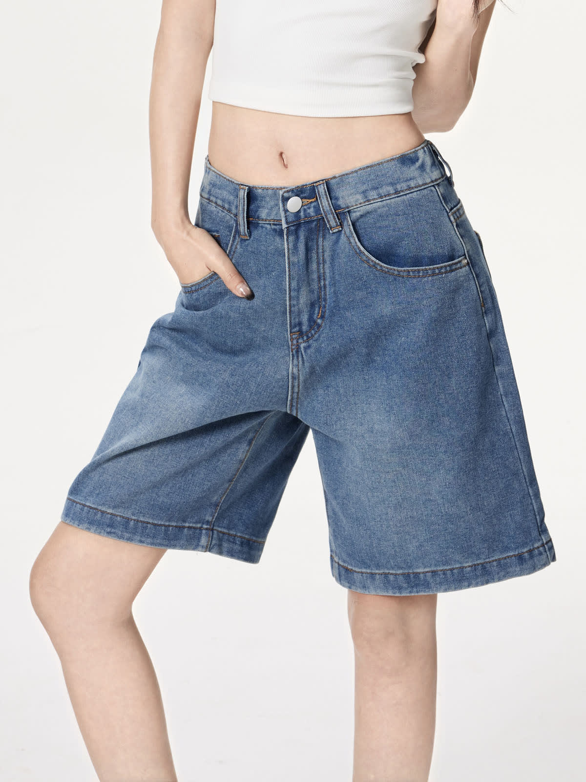 YEEYEEWang Denim Bermuda Shorts in Blue, Asian-fit cut, waist-down standing pose with hand in front pocket variant thumbnail.