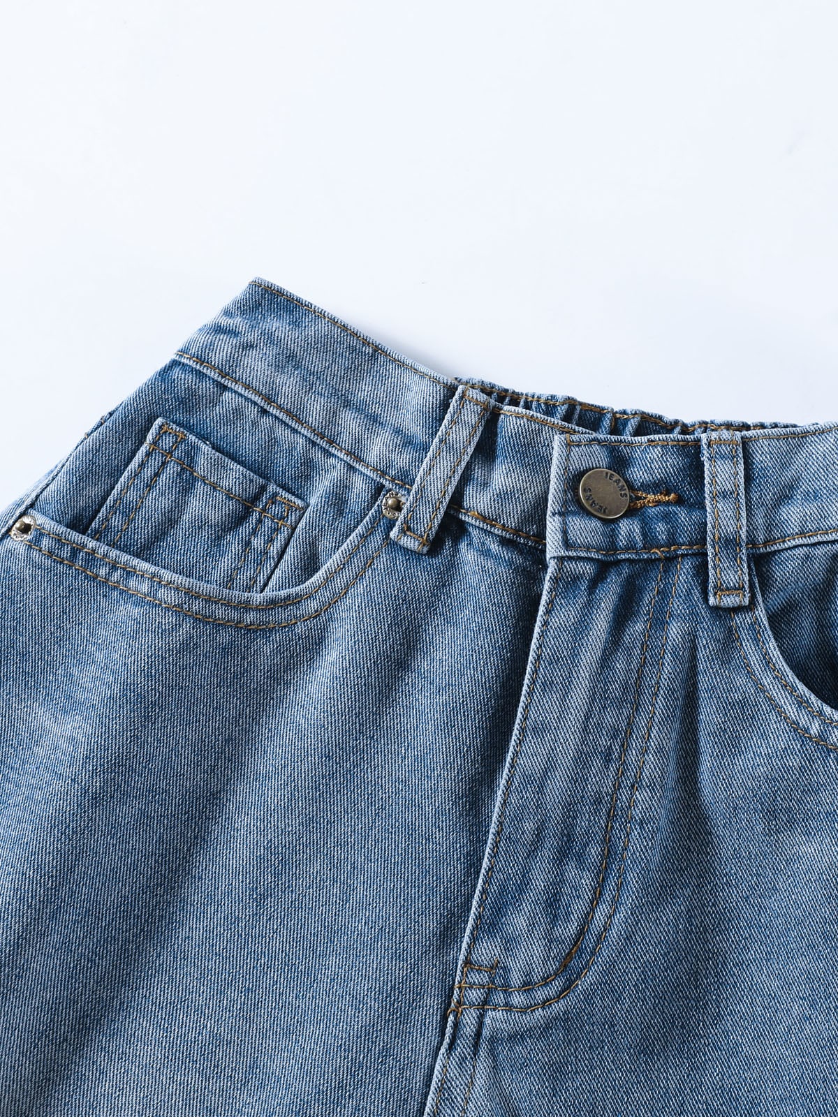 YEEYEEWang Denim Bermuda Shorts in Blue, Asian-fit cut, close-up of front waistband with antique bronze button, belt loops and front pocket stitching.