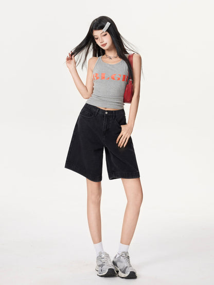 YEEYEEWang Denim Bermuda Shorts in Solid Black, Asian-fit cut, full-body three-quarter front pose touching her hair, red bag on shoulder, grey tank top and sneakers.