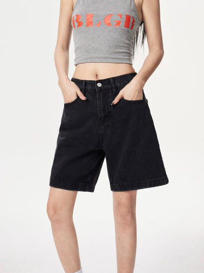 YEEYEEWang Denim Bermuda Shorts in Solid Black, Asian-fit cut, waist-down front view, hands in front pockets, metal button at waistband.