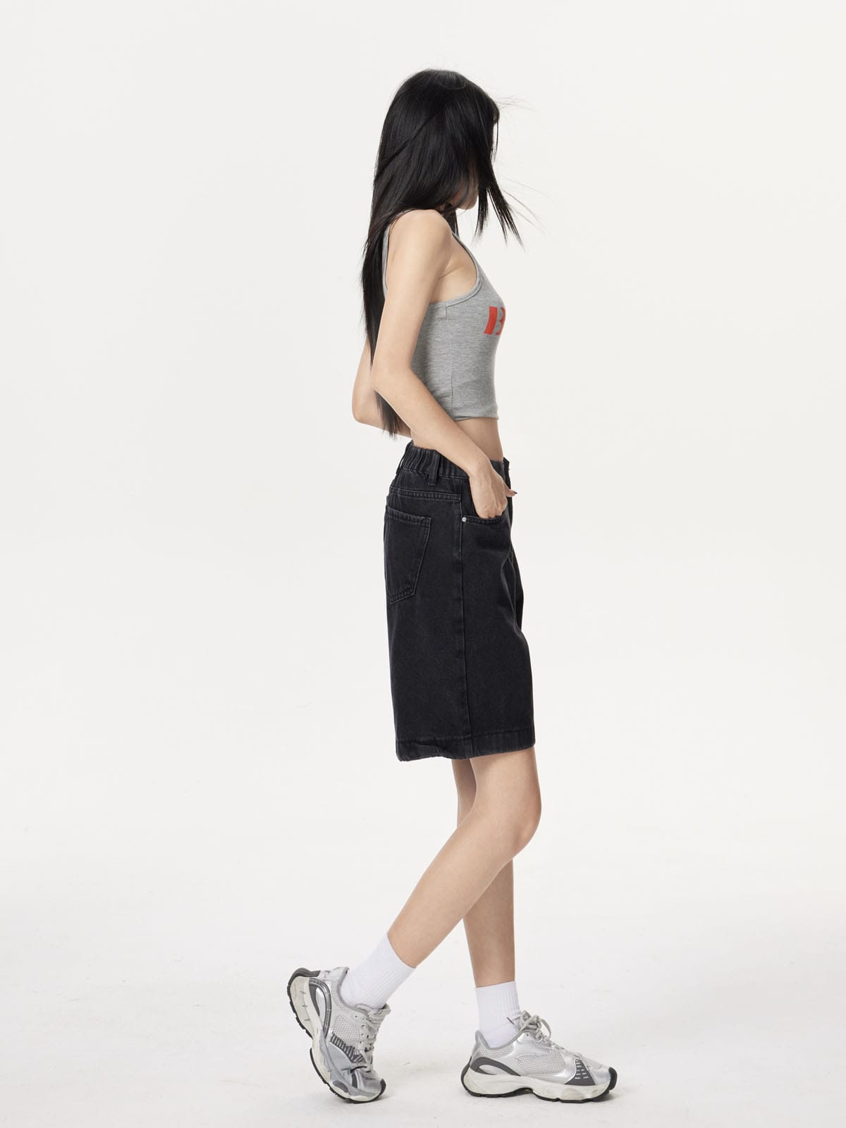 YEEYEEWang Denim Bermuda Shorts in Solid Black, Asian-fit cut, full-body side standing pose, showing side seam and back patch pocket.