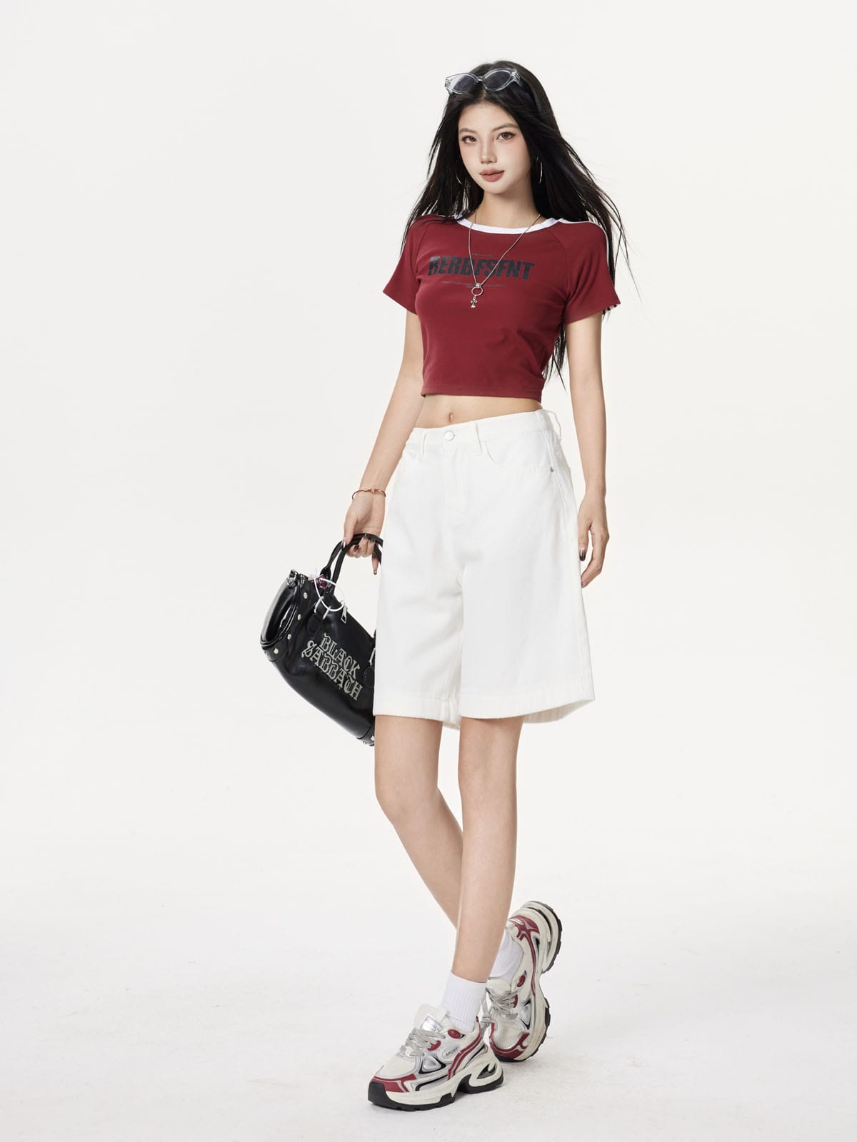 YEEYEEWang Denim Bermuda Shorts in Ivory, Asian-fit cut, full-body front walking pose, carrying a black handbag at side.