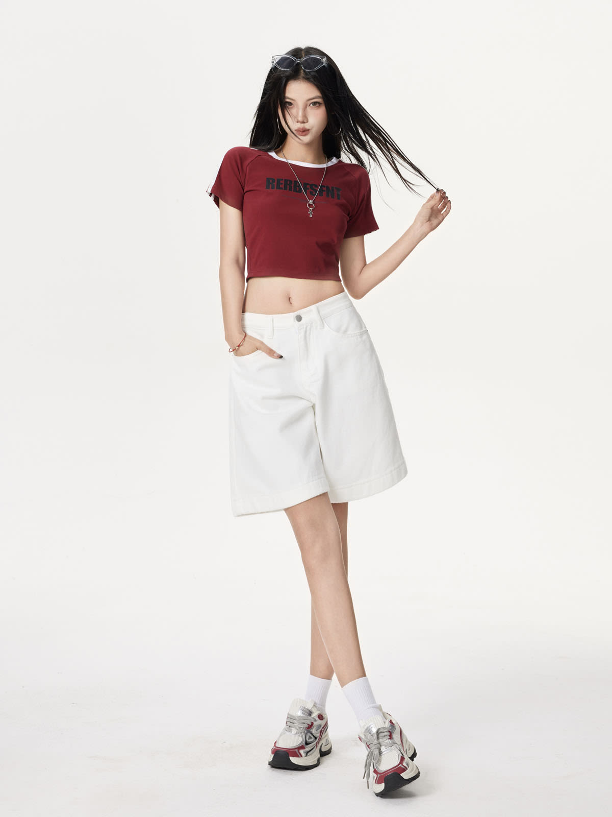 YEEYEEWang Denim Bermuda Shorts in Ivory, Asian-fit cut, full-body front standing pose, one hand in pocket, other hand touching hair.