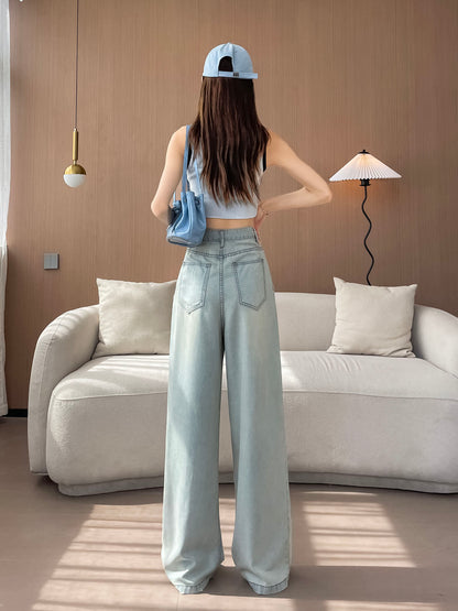 YEEYEEWang Wide-Leg Jeans in Light Blue, Asian-fit cut, full-body back view standing with back patch pockets, cap and blue shoulder bag.