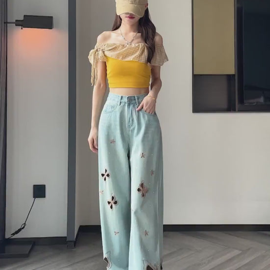 YEEYEEWang Wide-Leg jeans video in Light Blue, Asian model walks and turns, showing butterfly cutout embroidery, rhinestones, ripped hems and loose drape details
