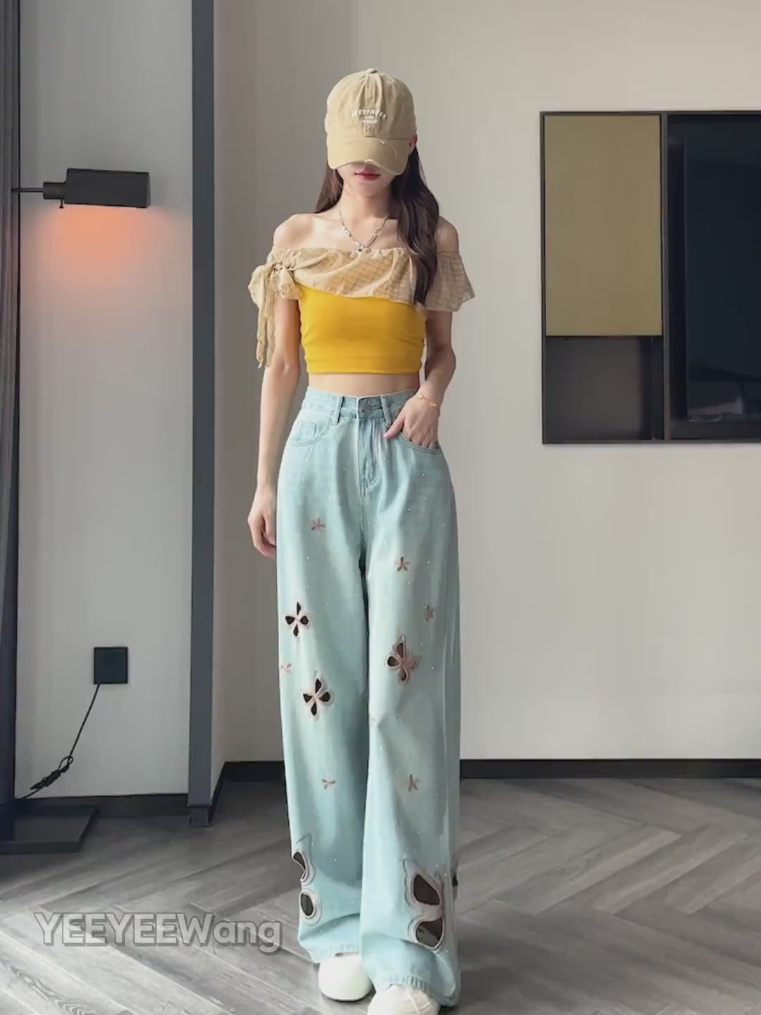 YEEYEEWang Wide-Leg jeans video in Light Blue, Asian model walks and turns, showing butterfly cutout embroidery, rhinestones, ripped hems and loose drape details