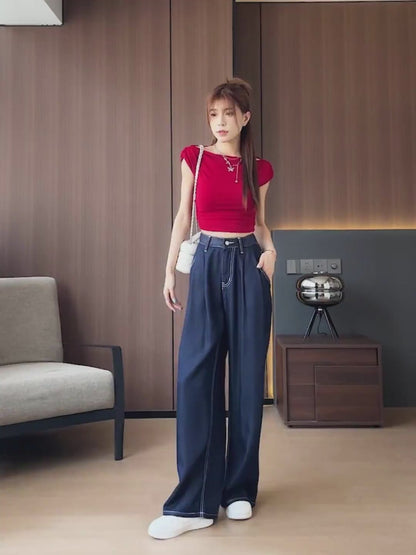 YEEYEEWang Wide-Leg jeans video: Asian model in Denim Blue walks and poses, camera pans down to high waist, white topstitched pockets and wide drape, lifts leg showing floor-length cuffed hem