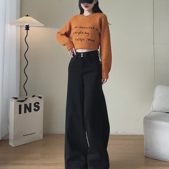 YEEYEEWang Wide-Leg jeans video Fleece-Lined in Solid Black: Asian model stands, pockets hands and lifts leg showing drapey fit, camera zooms to waist, then she folds hem to reveal thick grey fleece.