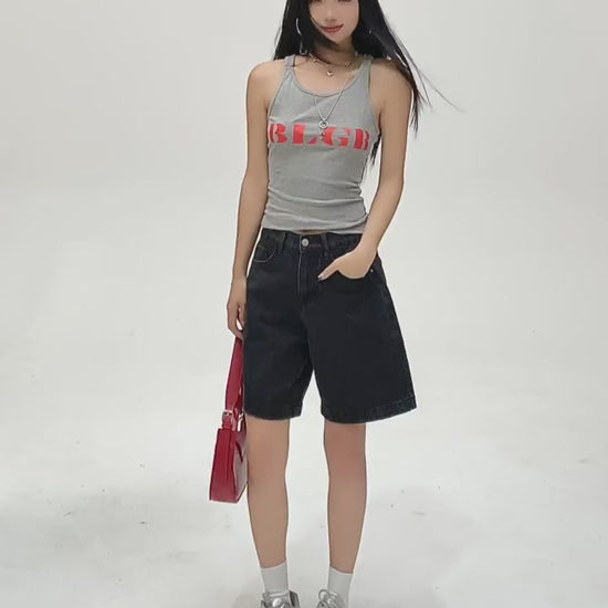 YEEYEEWang Denim Bermuda Shorts in Solid Black video: Asian model does 360 turns, side poses and hands-on-hips back view, showing high-waist relaxed straight cut, knee length and elastic back waist.