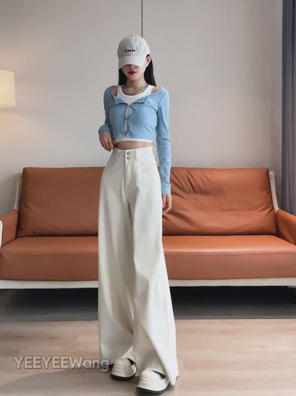 YEEYEEWang Wide-Leg jeans video in Ivory: Asian model walks and shifts poses showing floor-length drapey wide-leg fit, camera zooms to double-button high waist as she slips hands into pockets.