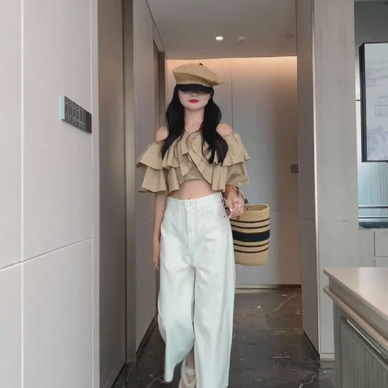 YEEYEEWang Wide-Leg jeans in Ivory video, Asian model walks forward and turns as camera moves in on waist and leg details, showing loose drape