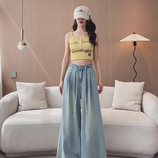 YEEYEEWang Wide-Leg jeans video: Asian model walks and turns in Light Blue high-waist wide-leg jeans with drawstring belt and elastic back waist, lifting legs to show soft drape.