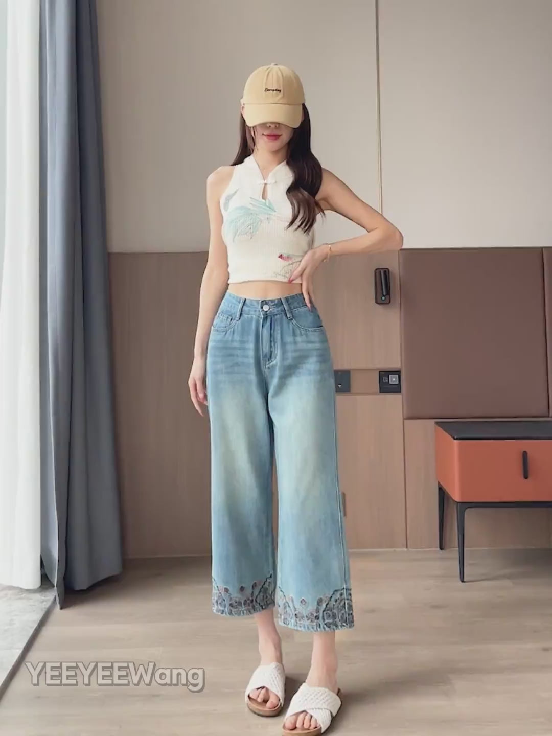 YEEYEEWang Straight jeans in Vintage Blue video: Asian model walks and poses in high-waist wide-leg jeans, showing drape, floral embroidered hems and faded wash under natural light.