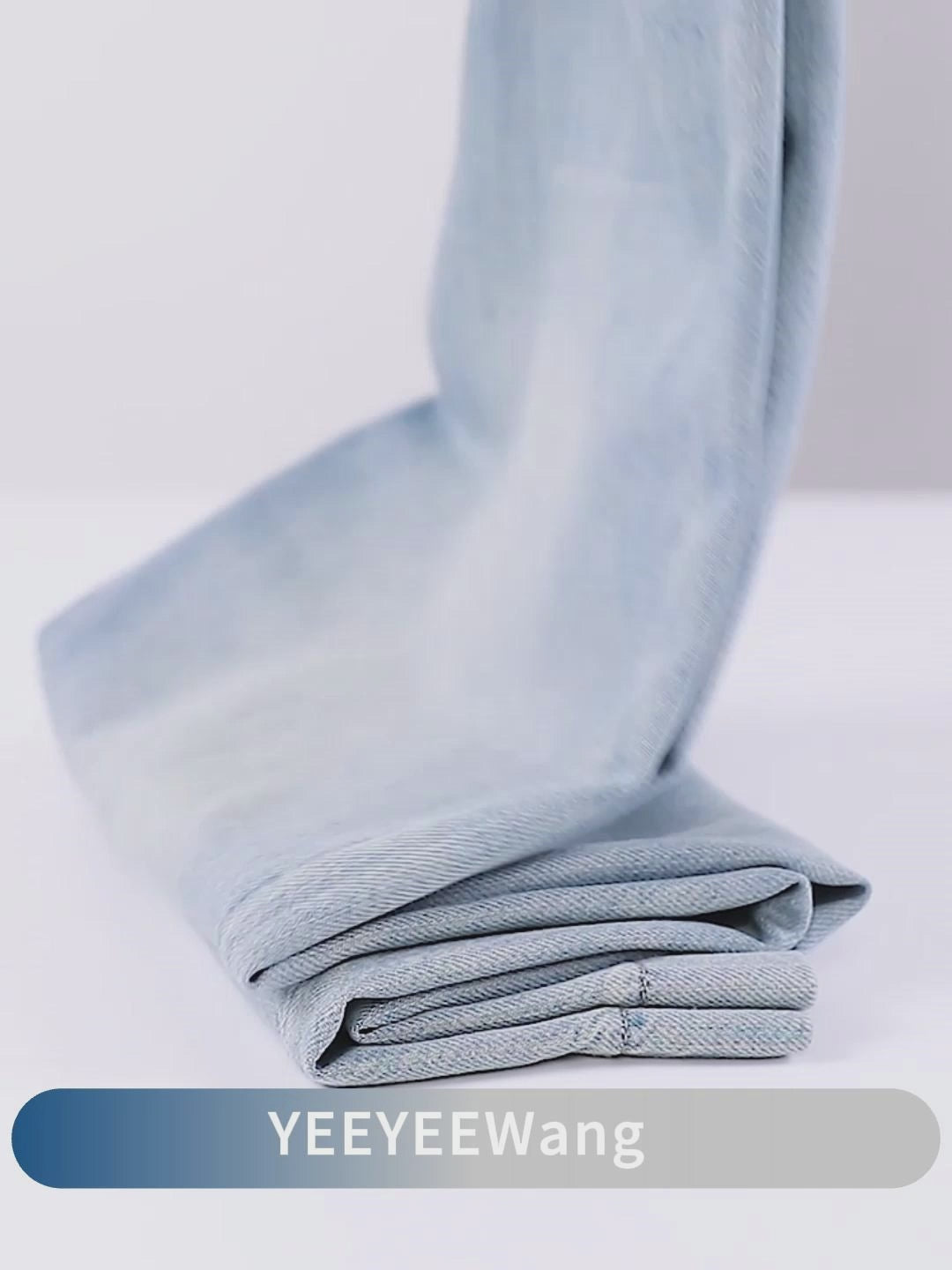 YEEYEEWang Wide-Leg jeans video in Light Blue: camera pans down Asian-fit wide-leg cut to wide stitched hems, close-ups of fabric, button, zipper, pockets, scratch and wrinkle tests, stitching details.