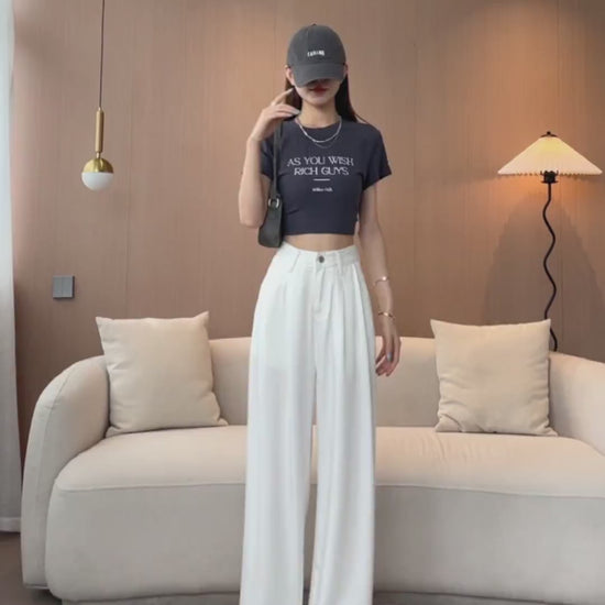 YEEYEEWang Wide-Leg jeans video: Asian model in White poses hand-on-hip, camera moves to high waist and front pleats, then down to leg lift showing wide-leg drape and floor-length hem