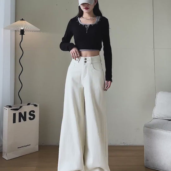 YEEYEEWang Wide-Leg jeans video Fleece-Lined in Ivory: Asian model stands, pockets hands and lifts leg showing floor-length drapey fit, camera zooms to double-button high waist and warm fleece feel.