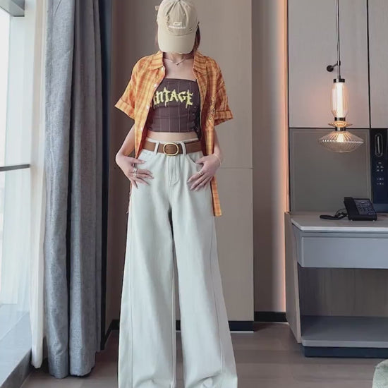 YEEYEEWang Dad Curved Jeans video, Asian model in Taupe Gray high-rise wide-leg jeans, hands in pockets, turning to show drape, camera zooms to belt details
