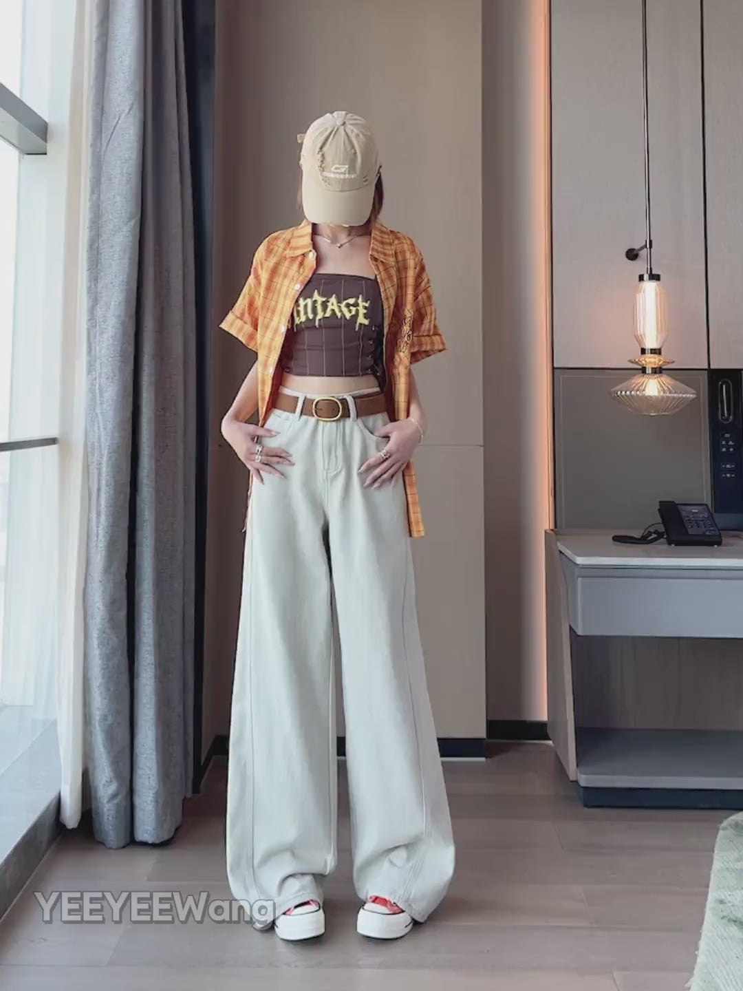 YEEYEEWang Dad Curved Jeans video, Asian model in Taupe Gray high-rise wide-leg jeans, hands in pockets, turning to show drape, camera zooms to belt details