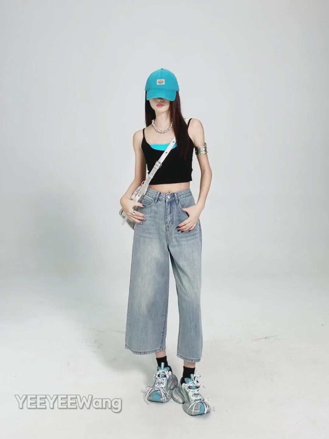 YEEYEEWang Wide-Leg jeans in Light Blue video, Asian model poses in white studio as camera zooms to waist and back pockets, showing fabric drape