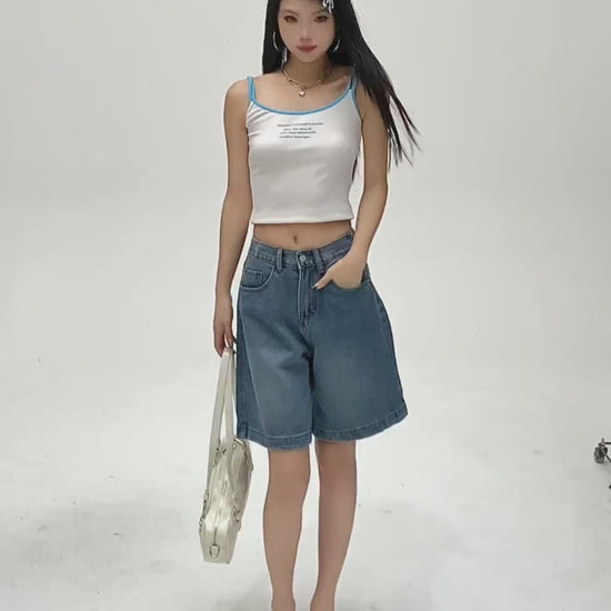 YEEYEEWang Denim Bermuda Shorts in Blue video: Asian model walks, turns and poses hands-in-pockets, showing high-waist wide-leg drape, elastic back waist, five pockets and rolled cuffs.